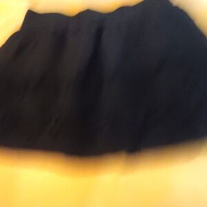 Women's size medium,  Stoosh black open weave skirt